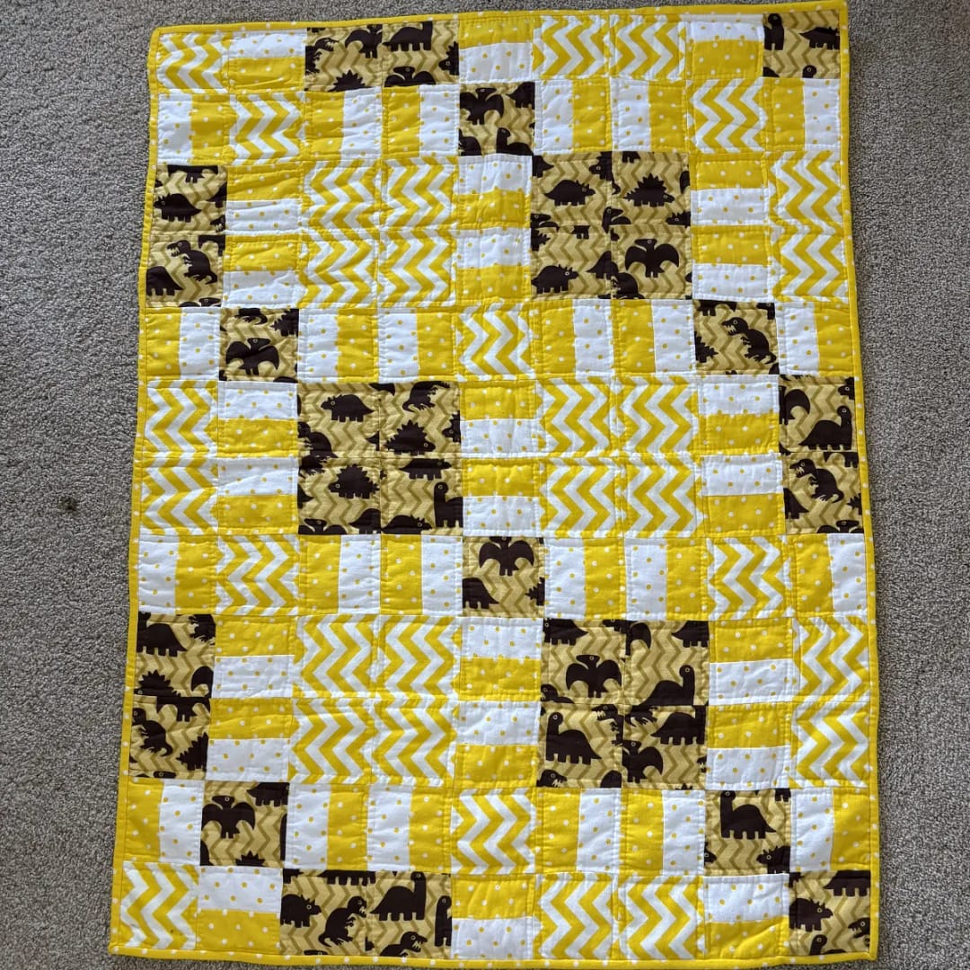 golden dinosaurs baby quilt full view