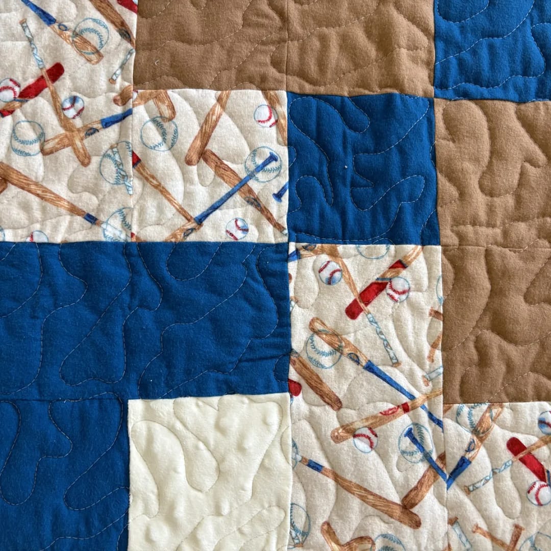Baseball Games Baby Quilt detail of solid colored squares and print