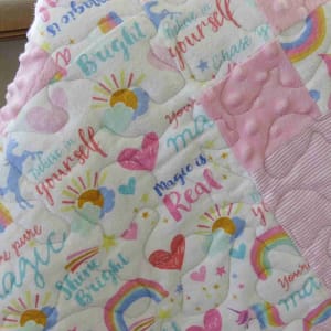pink unicorns and rainbows baby quilt