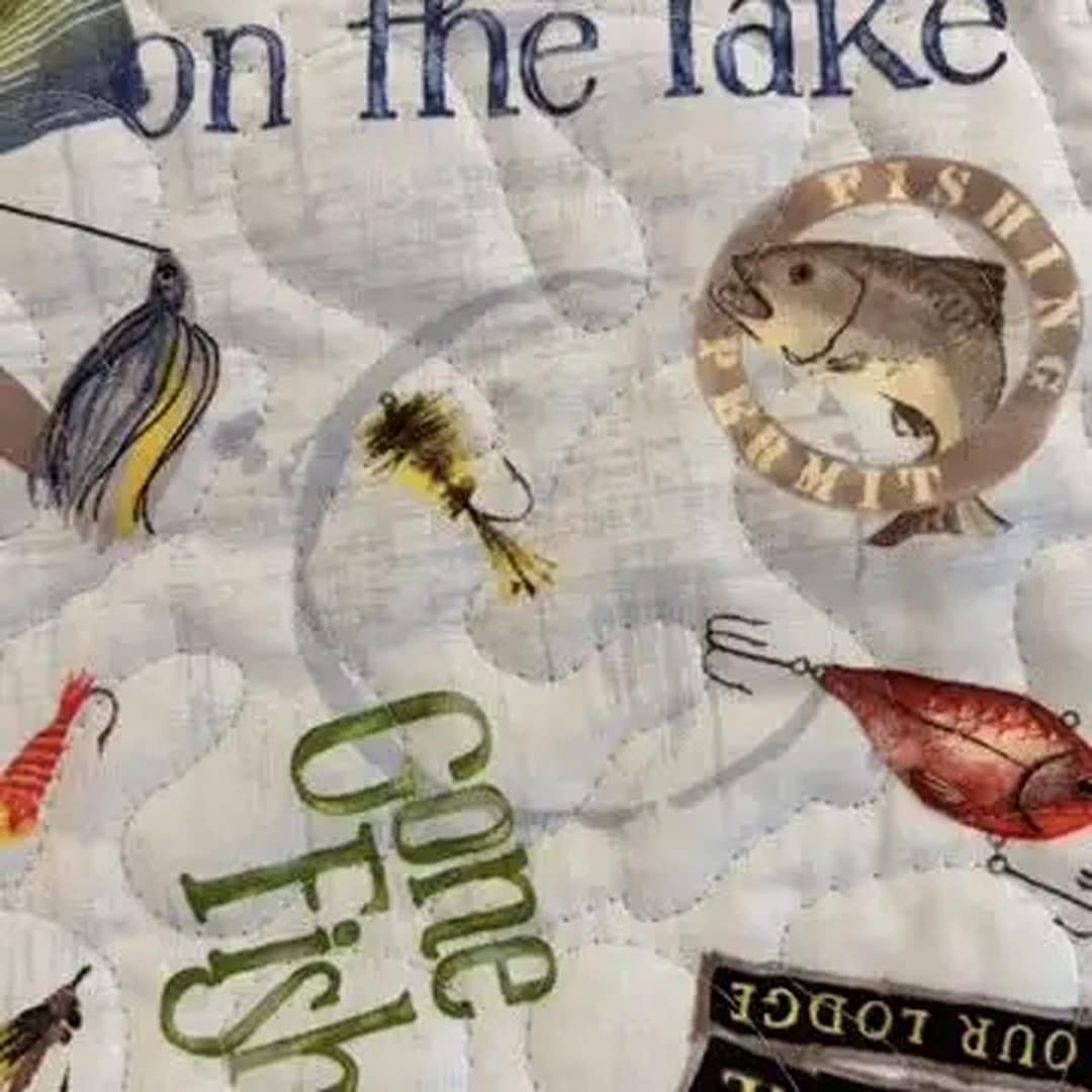 Gone Fishing Playmat detail of fish, lures and slogans