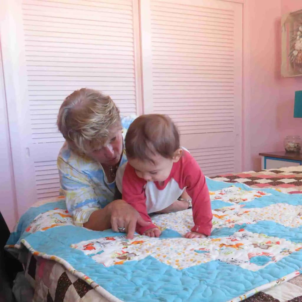 Grandma & Ryan on quilt