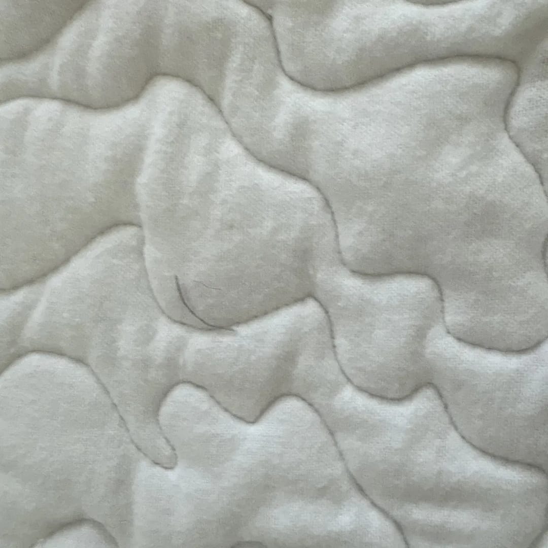 Grand Prix Baby Quilt closeup of solid white