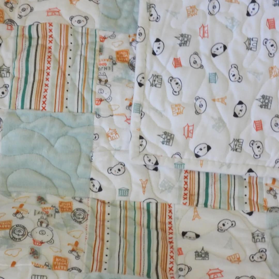 Animal Travelers Baby Quilt with folded backing