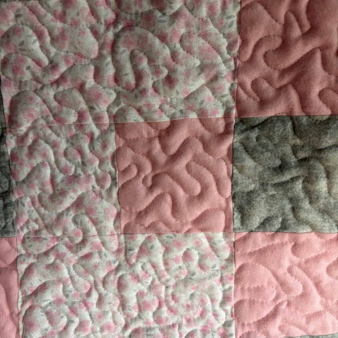 IBlush & Bloom Baby Quilt detail of solid and print squares