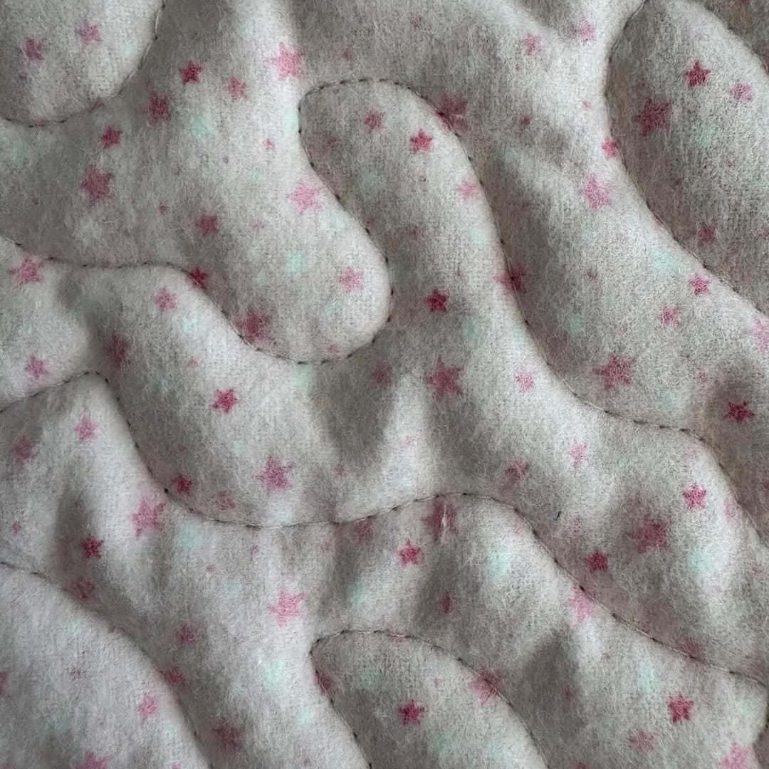 Safari Friends Baby Quilt close up detail of pink stars
