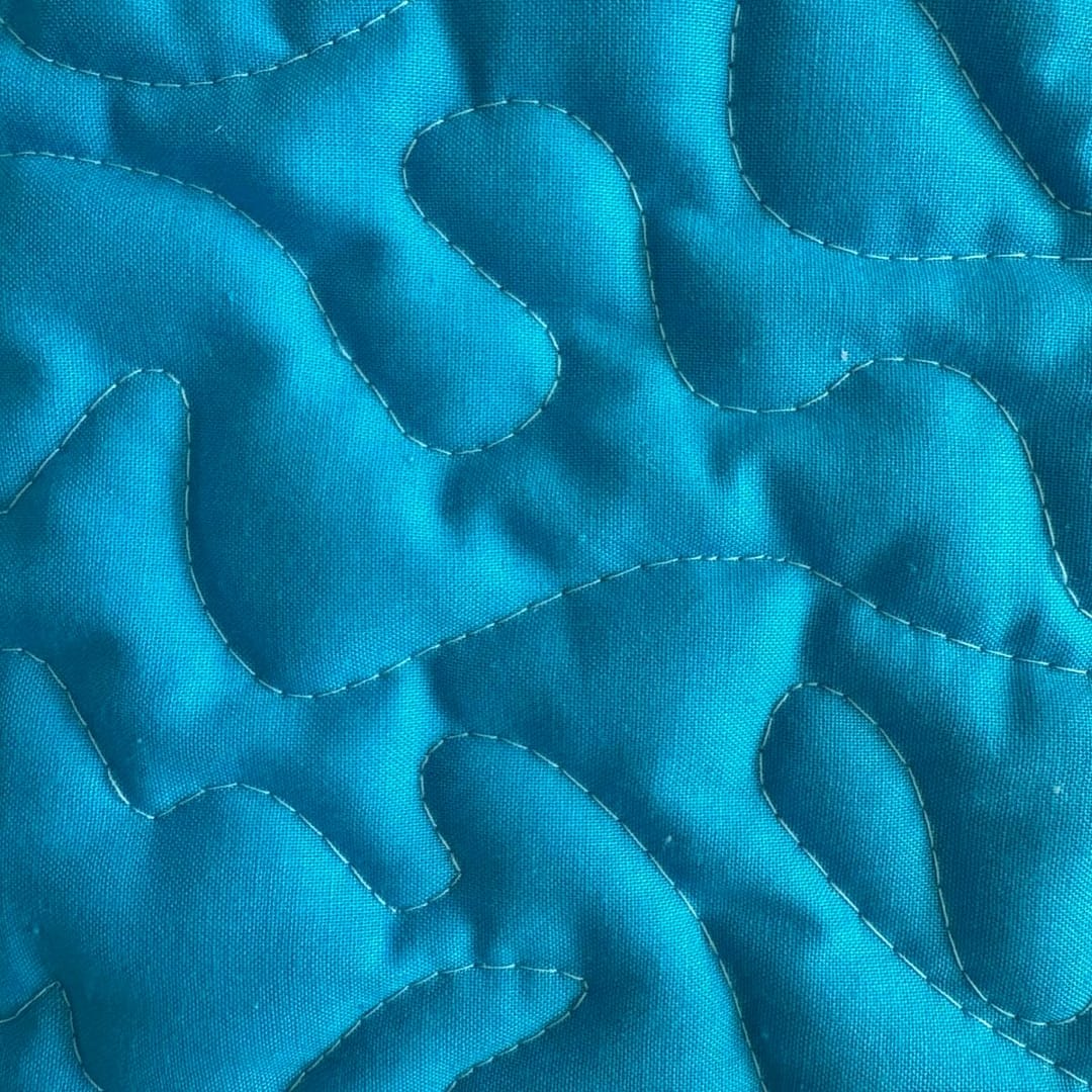 Unicorn Patchwork Baby Quilt detail of blue square