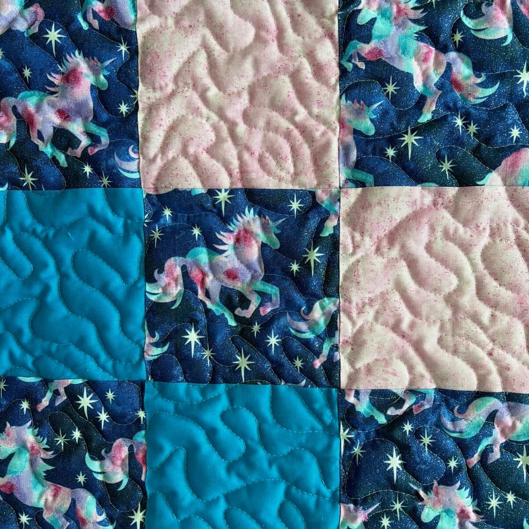 Unicorn Patchwork Baby Quilt detail of solid and print squares