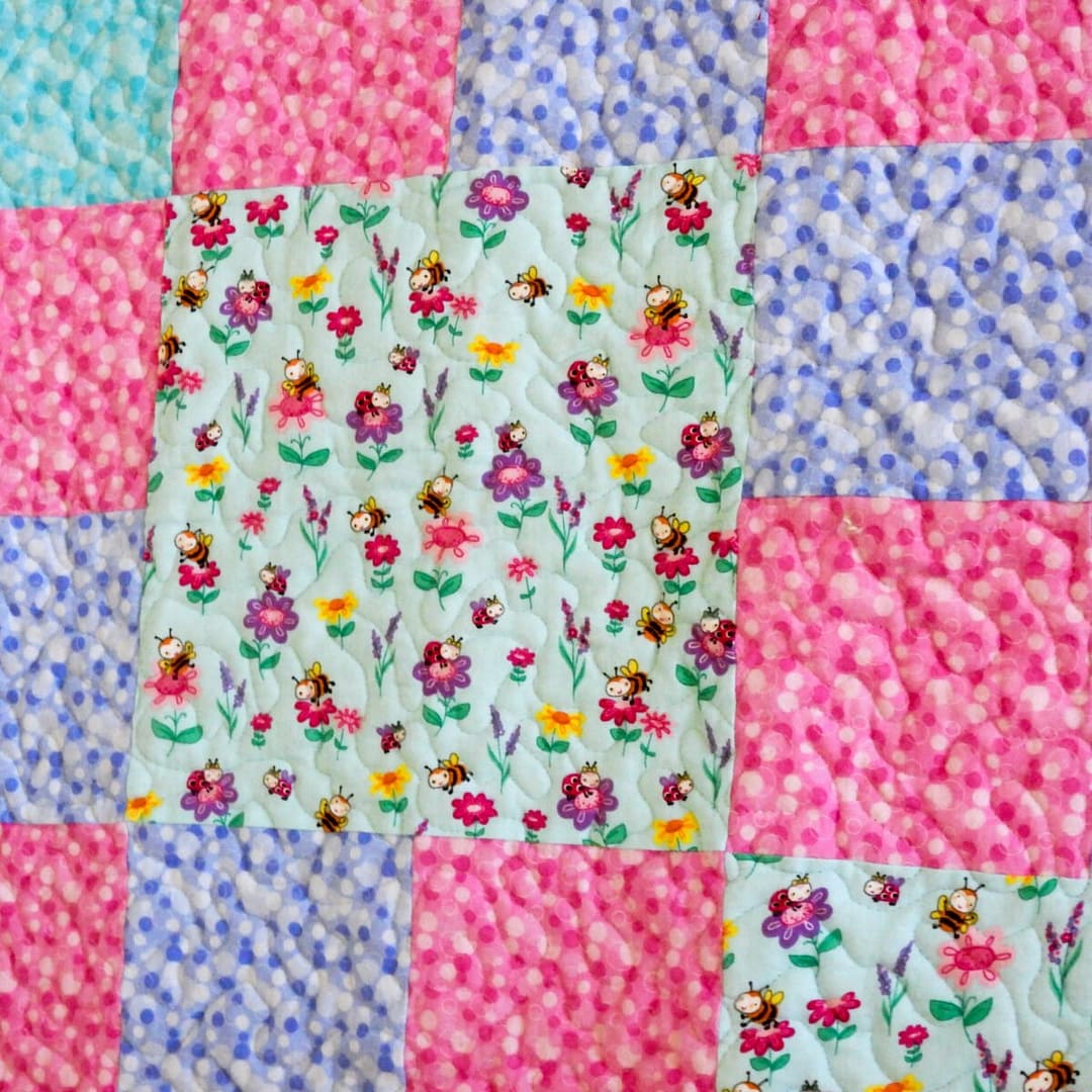 Bright Blooms Baby Quilt detail of patterned squares