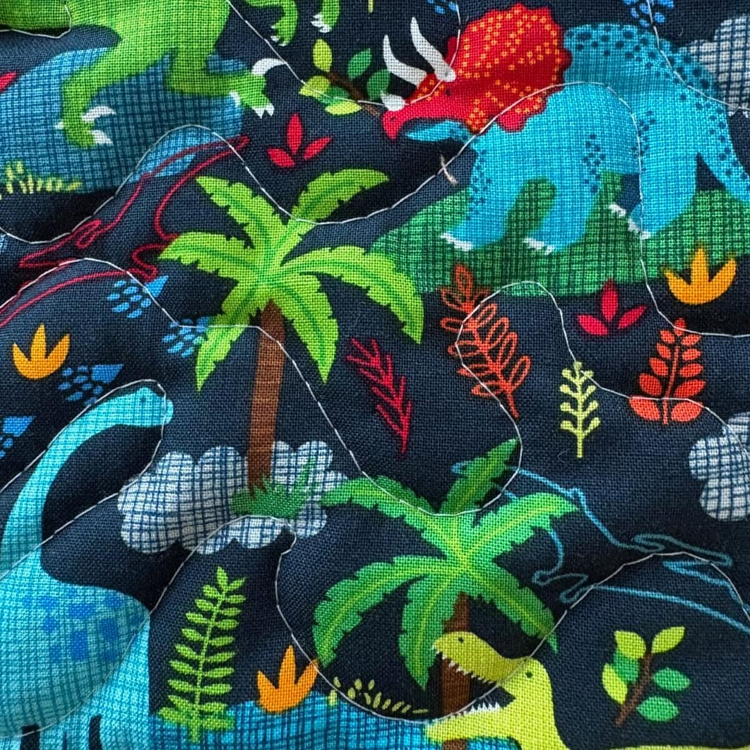 Dinosaur Dreams Baby Quilt detail of foilage