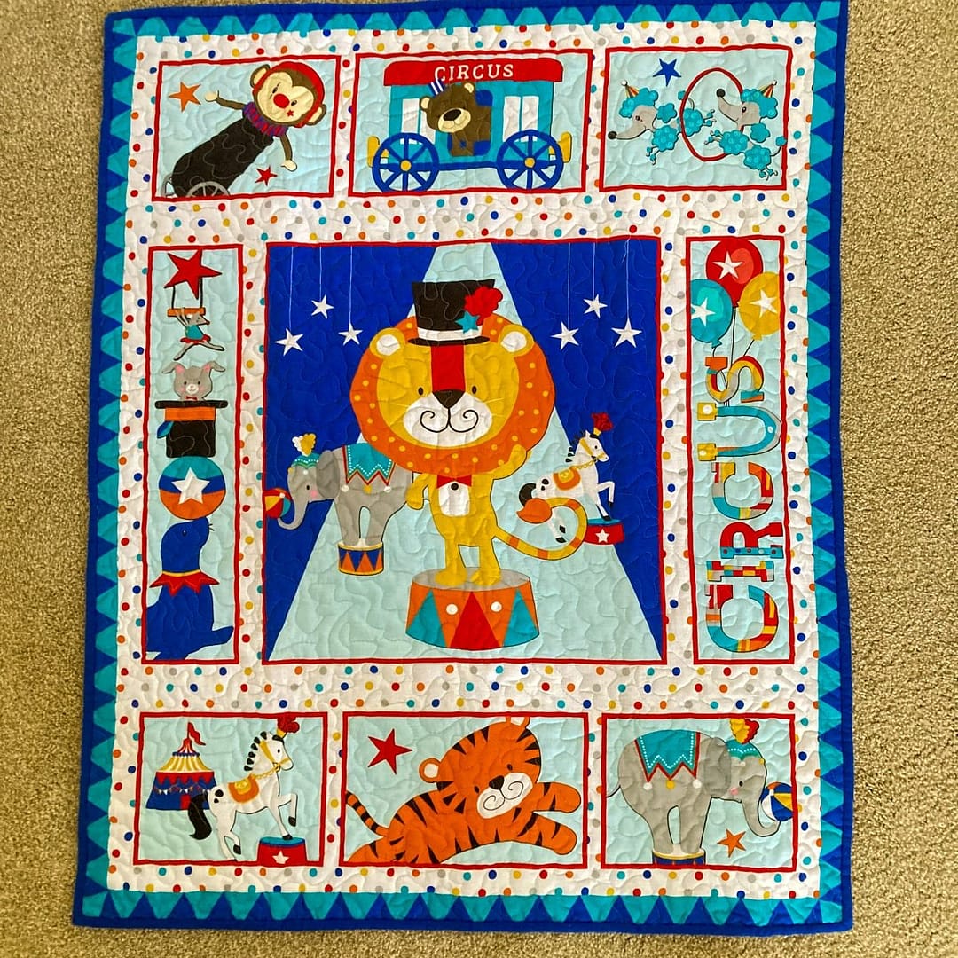 Circus Parade Baby Quilt with detail of full quilt