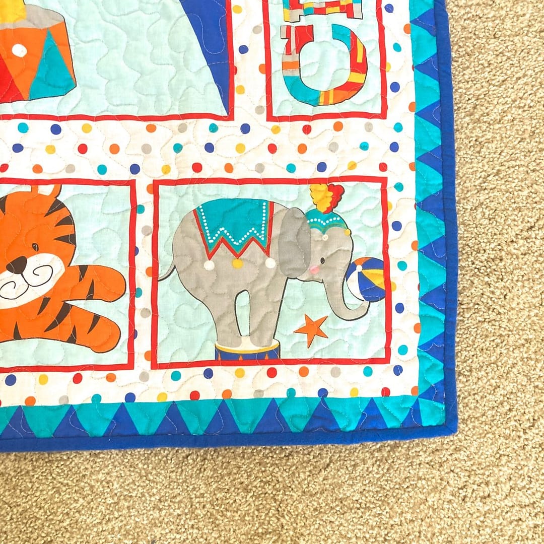 Circus Parade Baby Quilt with detail of elephant