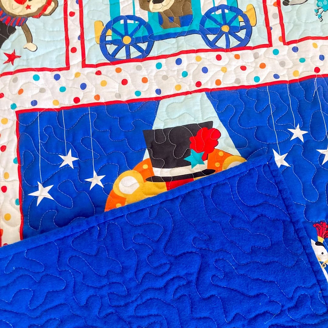 Circus Parade Baby Quilt with backing