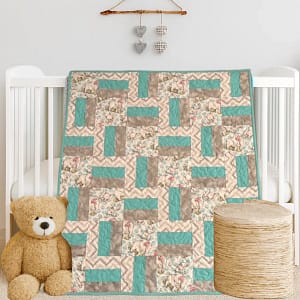 Baby Elephants Baby Quilt Product Image on white crib