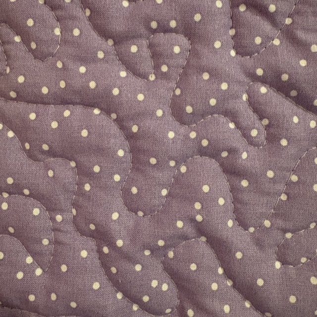 Handmade Unicorn Flannel Quilt detail of purple blocks