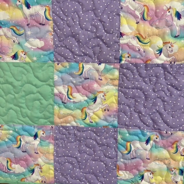 Handmade Unicorn Flannel Quilt detail of unicorn square and color blocks