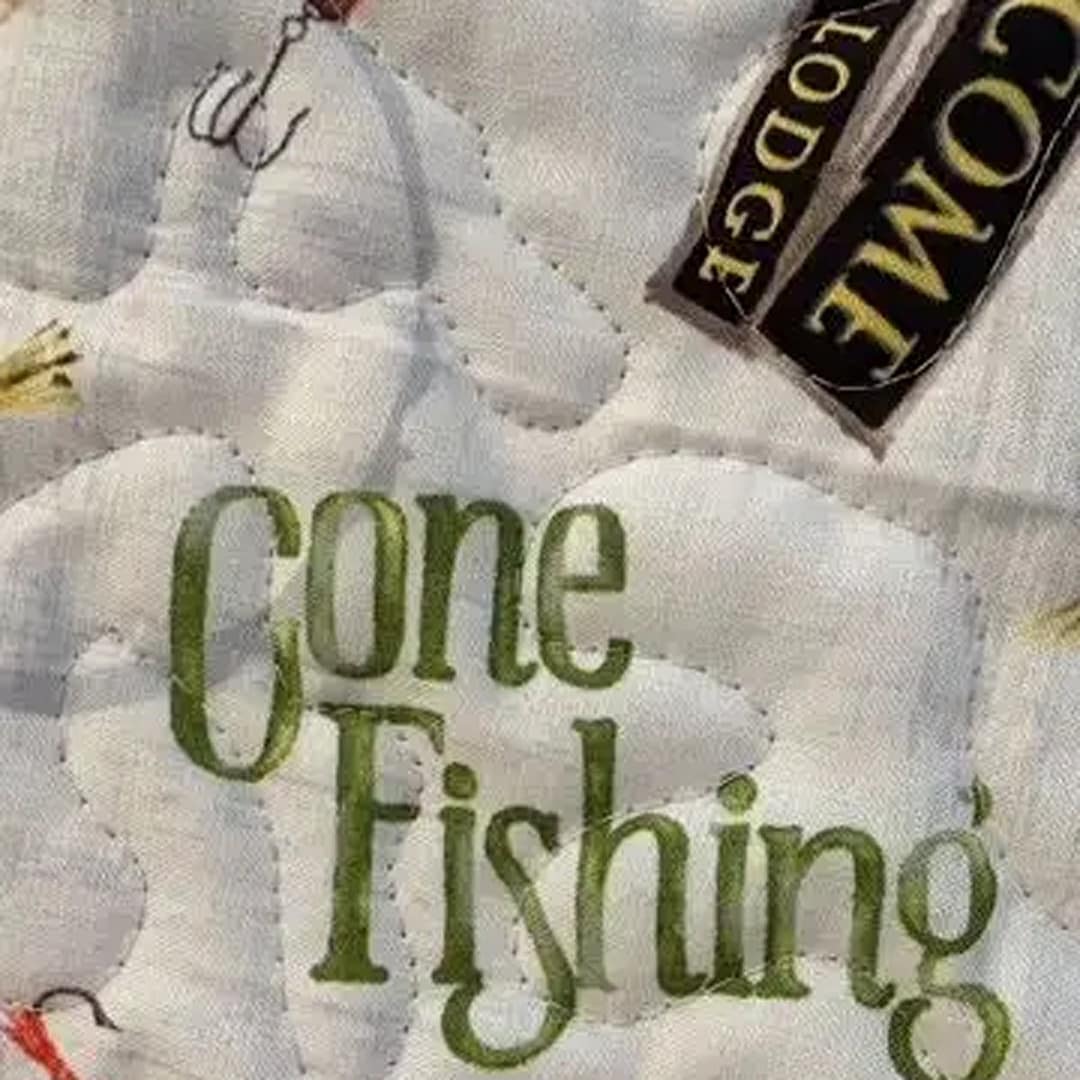 Gone Fishing Playmat with highlighted words "Gone Fishing"