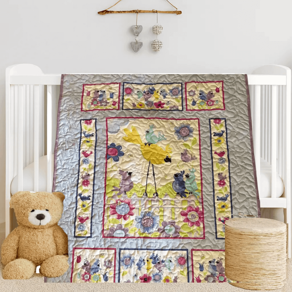 Bird Song in Bloom Baby Quilt on white crib with bear