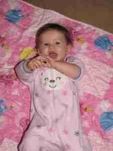 Abby on pink quilt